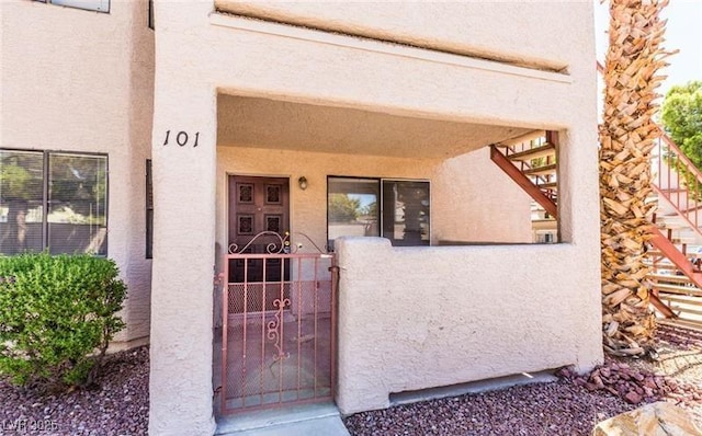 805 Rock Springs Dr Unit 101, Las Vegas, NV 89128 - entrance to property featuring stucco siding and a gate