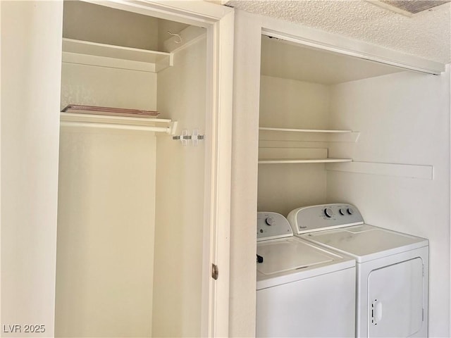 805 Rock Springs Dr Unit 101, Las Vegas, NV 89128 - washroom with washing machine and clothes dryer and a textured ceiling