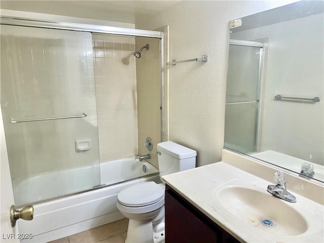 805 Rock Springs Dr Unit 101, Las Vegas, NV 89128 - full bath with vanity, tile patterned floors, and bath / shower combo with glass door