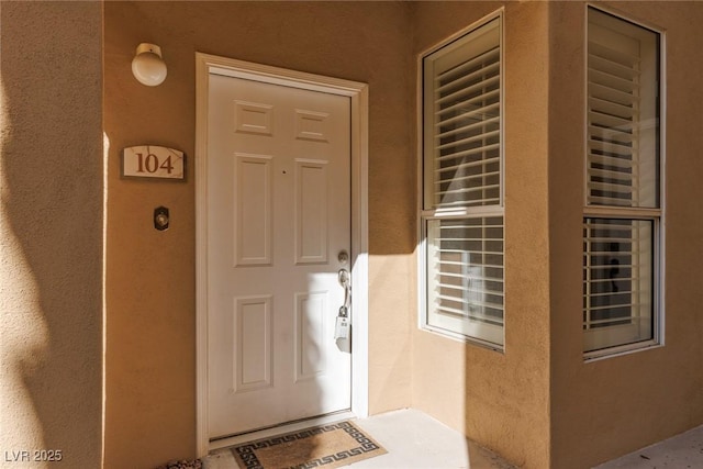 1609 Hills Of Red Dr Unit 104, Las Vegas, NV 89128 - doorway to property featuring stucco siding