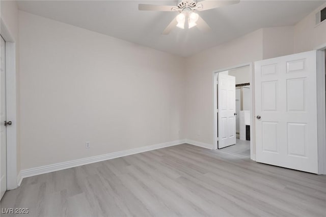 1609 Hills Of Red Dr Unit 104, Las Vegas, NV 89128 - unfurnished bedroom featuring light wood-style flooring and a ceiling fan