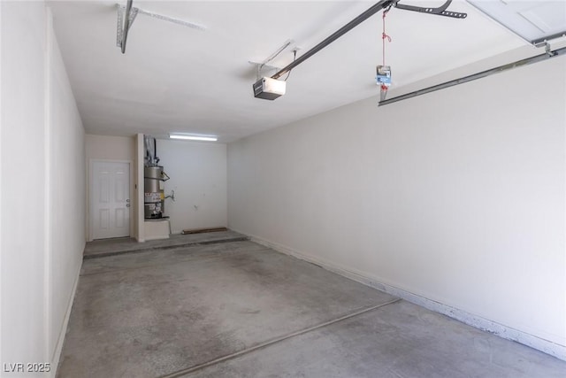 1609 Hills Of Red Dr Unit 104, Las Vegas, NV 89128 - garage with a garage door opener and baseboards