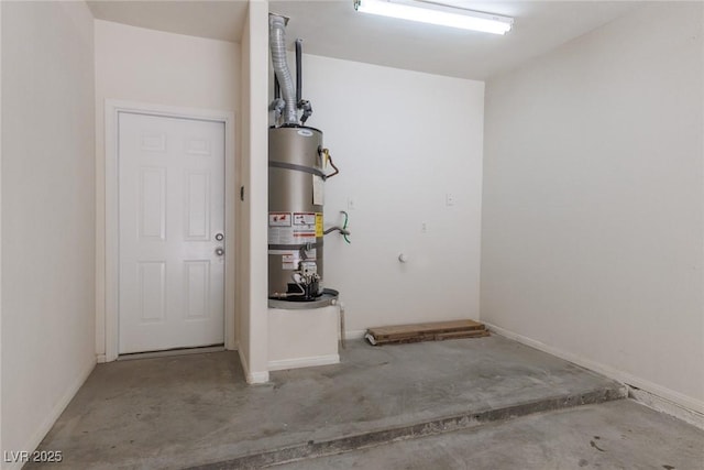 1609 Hills Of Red Dr Unit 104, Las Vegas, NV 89128 - garage with strapped water heater and baseboards