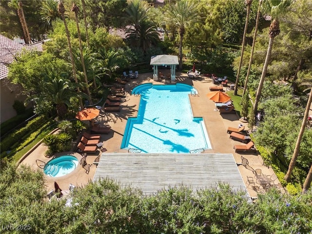 1609 Hills Of Red Dr Unit 104, Las Vegas, NV 89128 - community pool featuring a gazebo, a patio, and view of scattered trees