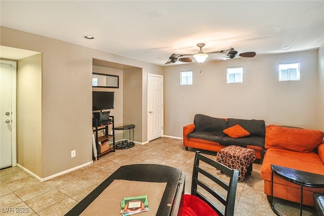 9068 Alluring Ave, Las Vegas, NV 89149 - living area featuring light tile patterned floors, a ceiling fan, and healthy amount of natural light