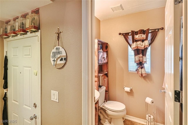 9068 Alluring Ave, Las Vegas, NV 89149 - bathroom featuring toilet and baseboards