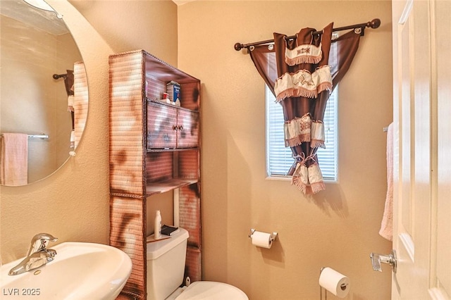 9068 Alluring Ave, Las Vegas, NV 89149 - bathroom with a sink and toilet