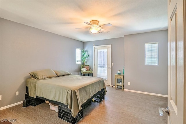 9068 Alluring Ave, Las Vegas, NV 89149 - bedroom with access to outside, light wood-style flooring, and a ceiling fan