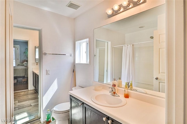 9068 Alluring Ave, Las Vegas, NV 89149 - full bathroom featuring vanity, a shower with shower curtain, and wood finished floors
