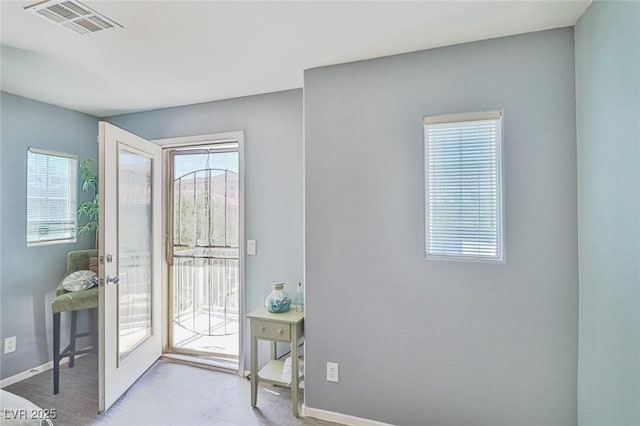 9068 Alluring Ave, Las Vegas, NV 89149 - foyer entrance featuring healthy amount of natural light, wood finished floors, and french doors