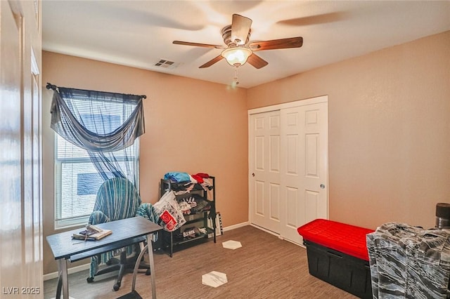 9068 Alluring Ave, Las Vegas, NV 89149 - bedroom featuring wood finished floors, a closet, and ceiling fan