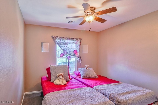 9068 Alluring Ave, Las Vegas, NV 89149 - bedroom with a ceiling fan and wood finished floors