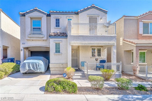 9068 Alluring Ave, Las Vegas, NV 89149 - mediterranean / spanish-style home with a tiled roof, a balcony, stucco siding, and an attached garage