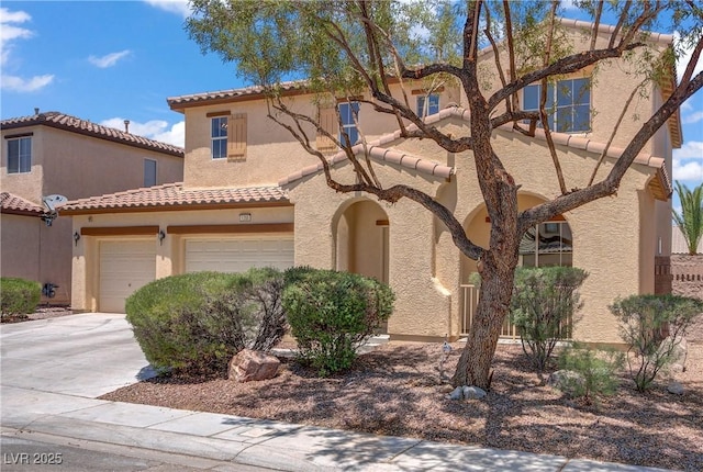 1208 Silver Bark Ave, North Las Vegas, NV 89081 - mediterranean / spanish-style home featuring driveway, a tiled roof, and stucco siding