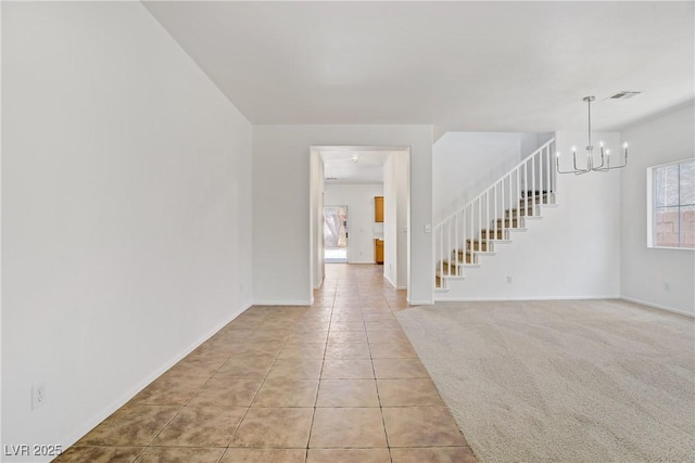 1208 Silver Bark Ave, North Las Vegas, NV 89081 - unfurnished room with a chandelier, light tile patterned flooring, and stairs