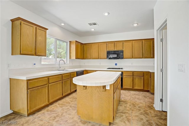 1208 Silver Bark Ave, North Las Vegas, NV 89081 - kitchen featuring black microwave, a kitchen island, brown cabinetry, recessed lighting, and stainless steel gas cooktop