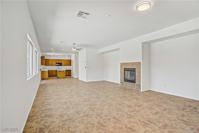 1208 Silver Bark Ave, North Las Vegas, NV 89081 - unfurnished living room featuring recessed lighting, a ceiling fan, and a tiled fireplace