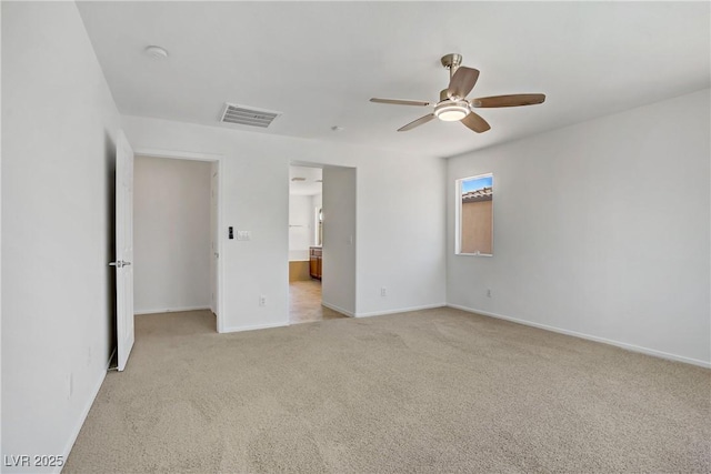 1208 Silver Bark Ave, North Las Vegas, NV 89081 - unfurnished bedroom with light carpet, a ceiling fan, and ensuite bathroom