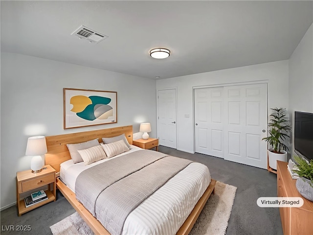 1208 Silver Bark Ave, North Las Vegas, NV 89081 - bedroom with a closet and dark carpet