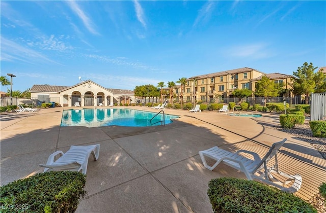 4588 Dover Straight St, Las Vegas, NV 89115 - community pool featuring a patio and a residential view