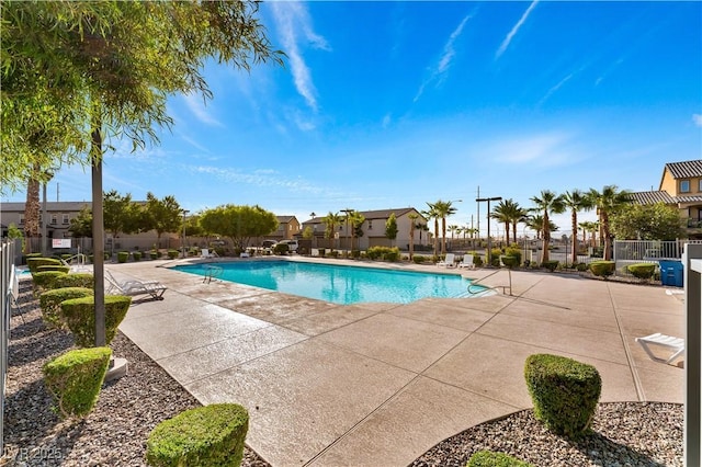 4588 Dover Straight St, Las Vegas, NV 89115 - community pool featuring a patio area and a residential view