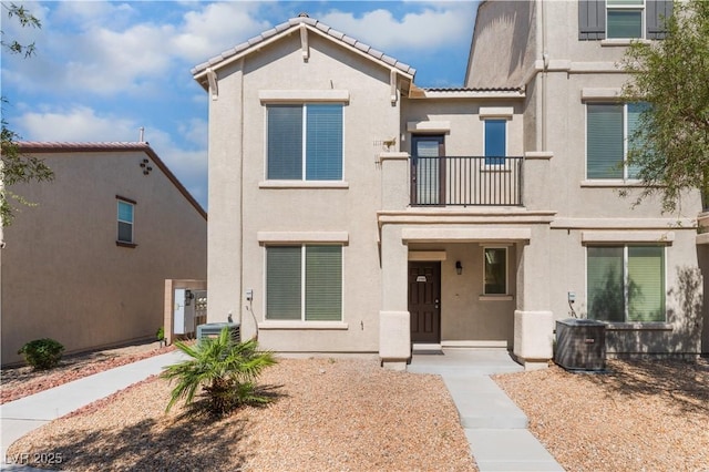 4588 Dover Straight St, Las Vegas, NV 89115 - mediterranean / spanish home featuring a balcony, stucco siding, and a tile roof