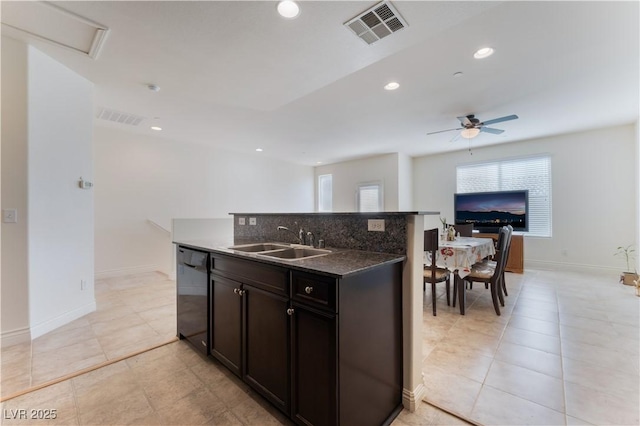 4588 Dover Straight St, Las Vegas, NV 89115 - kitchen featuring dishwasher, open floor plan, ceiling fan, a kitchen island with sink, and light tile patterned floors