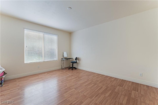 4588 Dover Straight St, Las Vegas, NV 89115 - empty room featuring light wood-style floors and baseboards