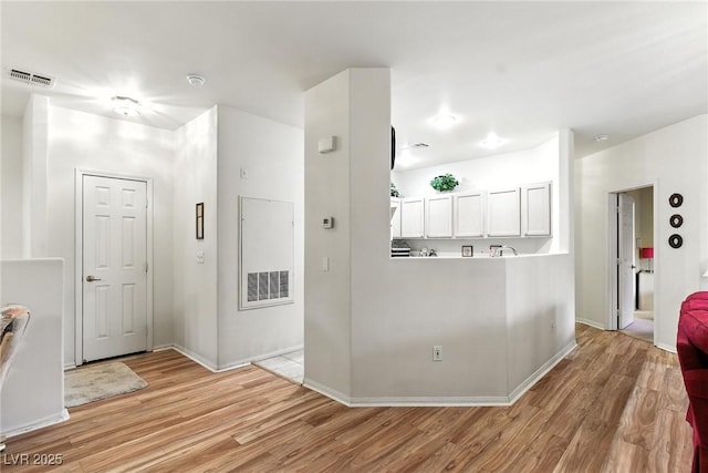 1713 Sky Of Red Dr Unit 201, Las Vegas, NV 89128 - hallway featuring light wood-style floors and baseboards