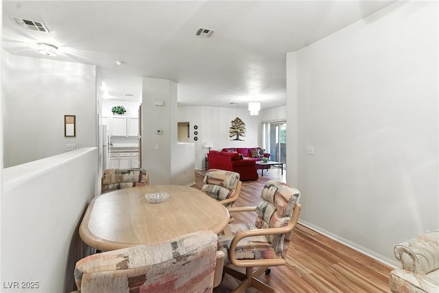1713 Sky Of Red Dr Unit 201, Las Vegas, NV 89128 - dining area with wood finished floors and baseboards