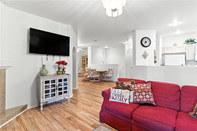 1713 Sky Of Red Dr Unit 201, Las Vegas, NV 89128 - living room with wood finished floors and arched walkways