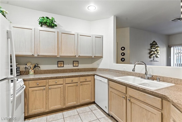 1713 Sky Of Red Dr Unit 201, Las Vegas, NV 89128 - kitchen featuring white appliances, light tile patterned floors, light countertops, and light brown cabinets