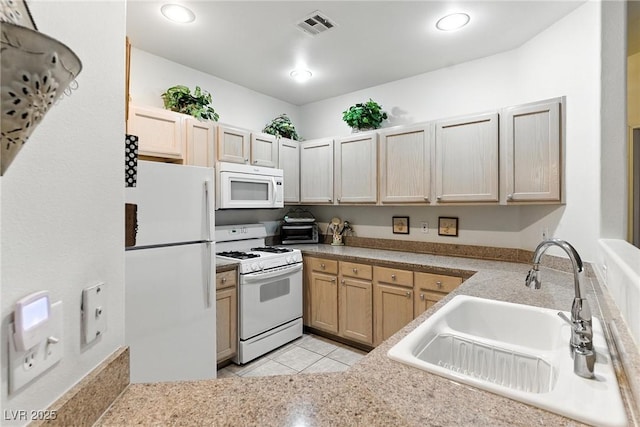 1713 Sky Of Red Dr Unit 201, Las Vegas, NV 89128 - kitchen with white appliances, light tile patterned floors, light countertops, and light brown cabinetry