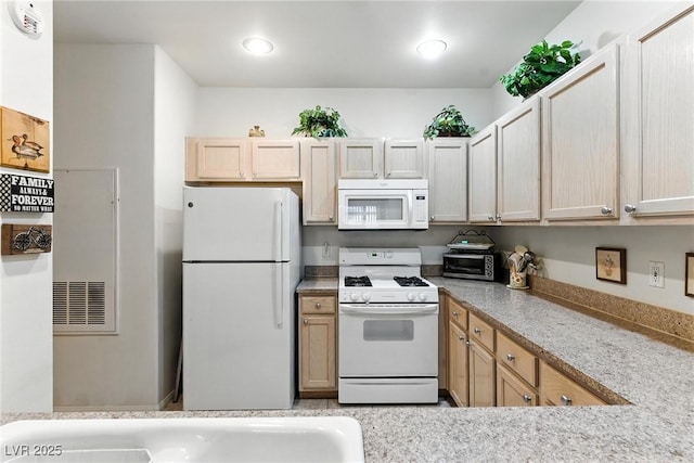 1713 Sky Of Red Dr Unit 201, Las Vegas, NV 89128 - kitchen with white appliances, light countertops, recessed lighting, and light brown cabinetry