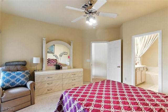 1713 Sky Of Red Dr Unit 201, Las Vegas, NV 89128 - bedroom with ensuite bathroom, ceiling fan, and light colored carpet