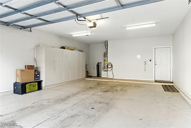 1713 Sky Of Red Dr Unit 201, Las Vegas, NV 89128 - garage with a garage door opener and gas water heater