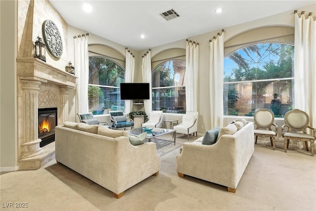 1713 Sky Of Red Dr Unit 201, Las Vegas, NV 89128 - carpeted living room with a high end fireplace and recessed lighting