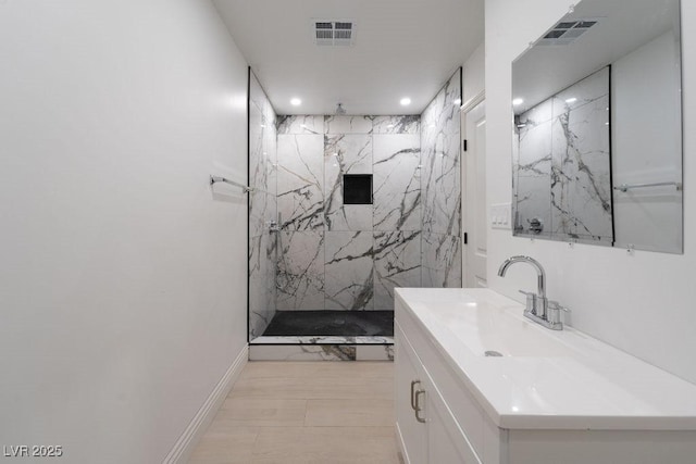 714 Lacy Ln, Las Vegas, NV 89107 - bathroom with recessed lighting, a marble finish shower, and vanity