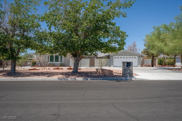 714 Lacy Ln, Las Vegas, NV 89107 - view of front of home with driveway and a garage