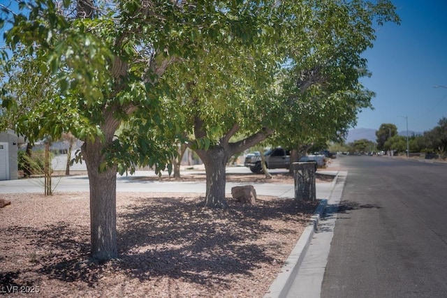 714 Lacy Ln, Las Vegas, NV 89107 - view of asphalt street with curbs and street lighting