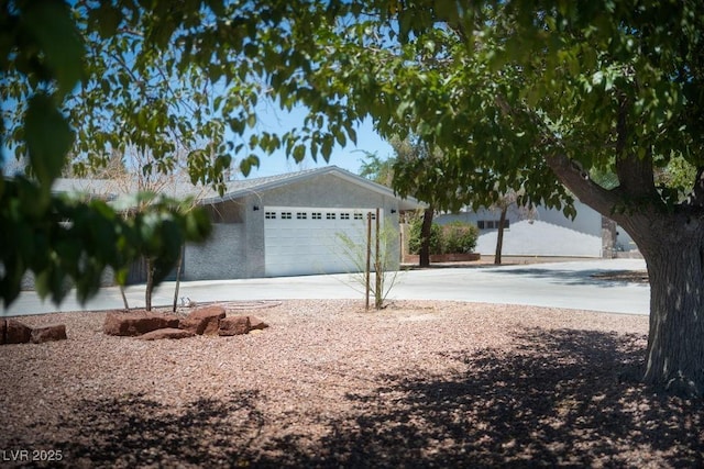 714 Lacy Ln, Las Vegas, NV 89107 - view of yard featuring driveway and an attached garage