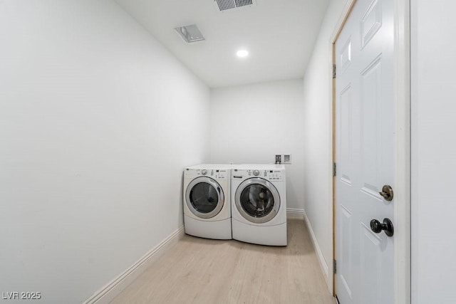 714 Lacy Ln, Las Vegas, NV 89107 - washroom featuring separate washer and dryer, light wood finished floors, and recessed lighting