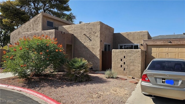 4232 Brockton Green Ct, Las Vegas, NV 89110 - view of property exterior featuring stucco siding and a garage