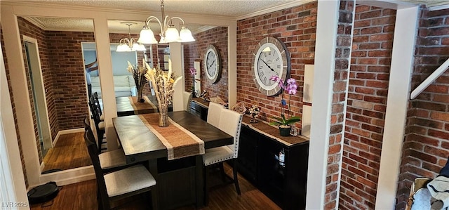 4232 Brockton Green Ct, Las Vegas, NV 89110 - dining room featuring brick wall, a chandelier, wood finished floors, crown molding, and a textured ceiling