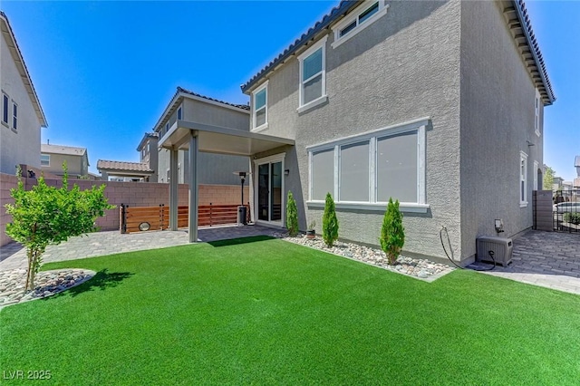 4133 Golden Fleece Ave, Las Vegas, NV 89141 - back of house with stucco siding, a fenced backyard, and a patio area
