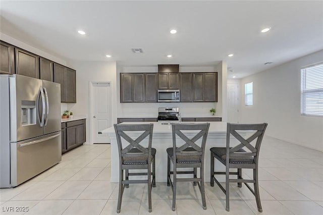 4133 Golden Fleece Ave, Las Vegas, NV 89141 - kitchen featuring stainless steel appliances, dark brown cabinets, light countertops, and recessed lighting