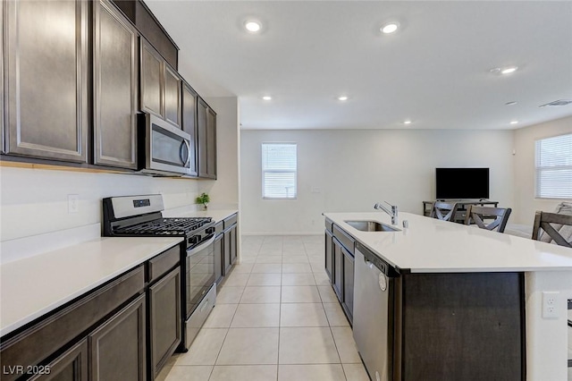4133 Golden Fleece Ave, Las Vegas, NV 89141 - kitchen with stainless steel appliances, dark brown cabinets, healthy amount of natural light, light countertops, and recessed lighting