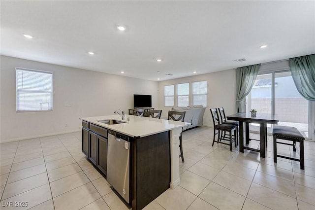 4133 Golden Fleece Ave, Las Vegas, NV 89141 - kitchen featuring stainless steel dishwasher, plenty of natural light, recessed lighting, light tile patterned floors, and light countertops