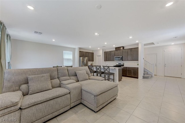 4133 Golden Fleece Ave, Las Vegas, NV 89141 - living area featuring light tile patterned floors, recessed lighting, and stairway