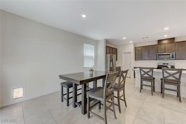 4133 Golden Fleece Ave, Las Vegas, NV 89141 - dining room with recessed lighting and light tile patterned floors